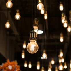 G125 LED pære, 6W, dobbelt spiral, kultråd, amber glas, E27, 400lm, RA80, 1800K